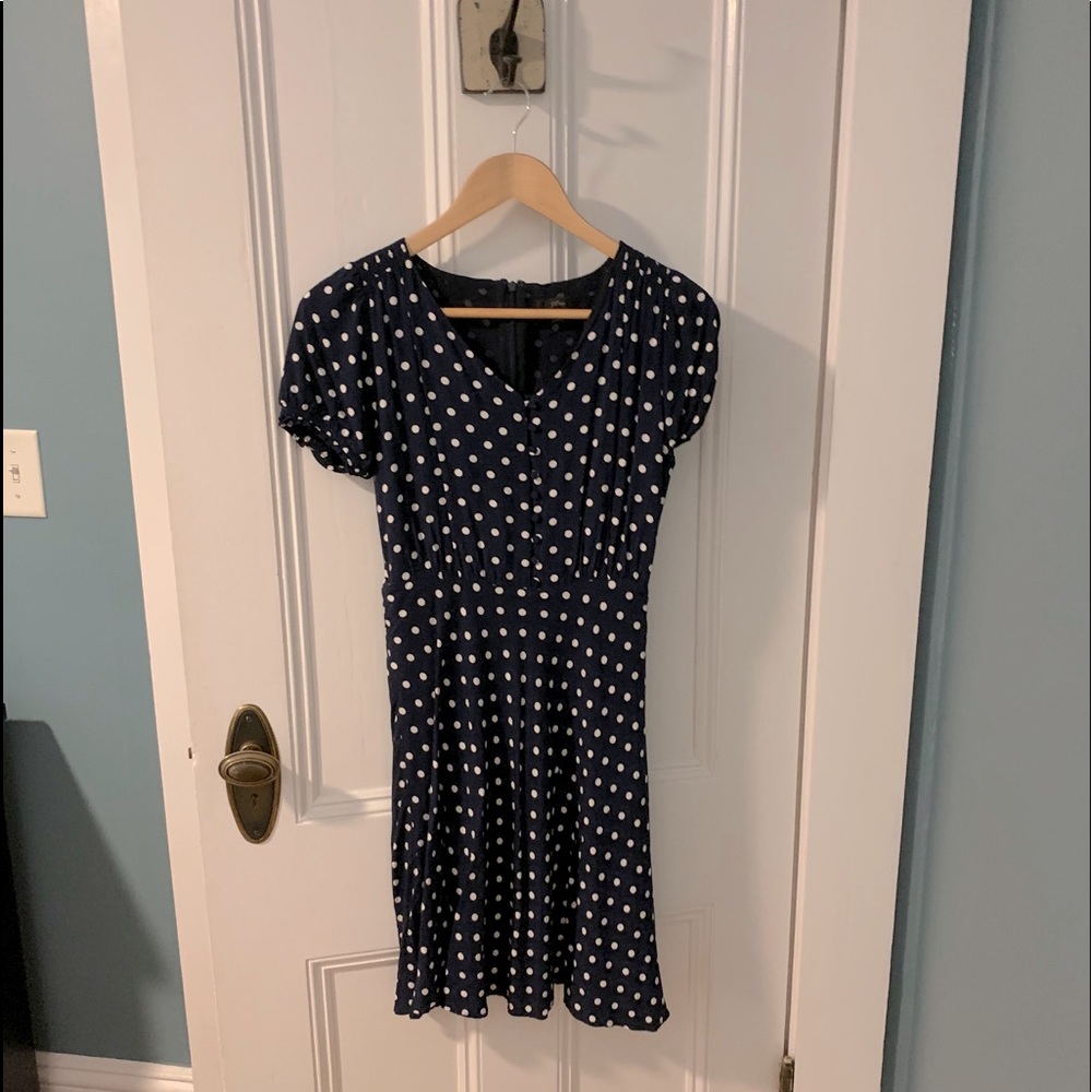 Vintage-style navy/white polka dot dress.
